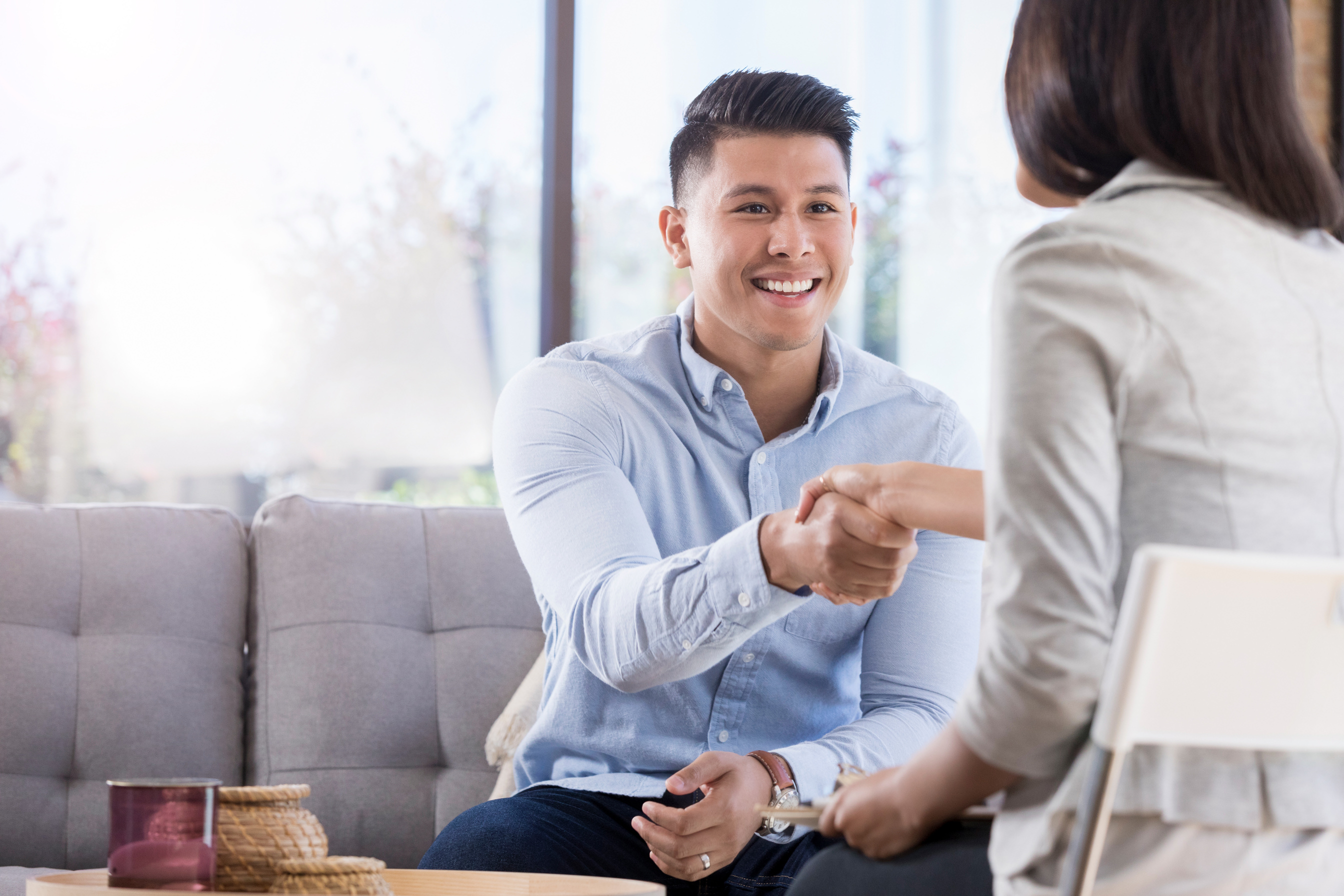 Young man greets counselor